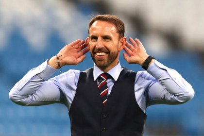 Gareth Southgate, the coach of England's national football team, English players kneel before the match against Iran