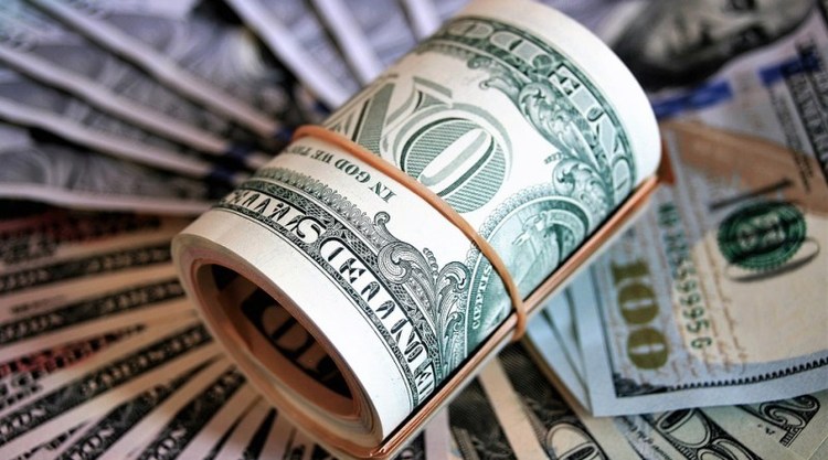How much currency can each traveler buy?