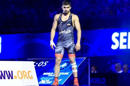 Awarding a Quarter Coin to the Asian Games Wrestling Champion